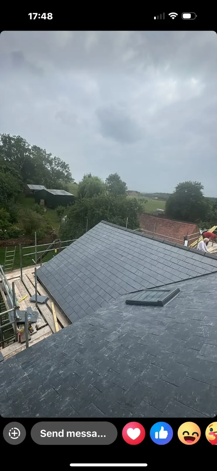 New pitched slate roof installation with roof window and scaffolding by STORMPROOF ROOFING & REPAIRS LTD