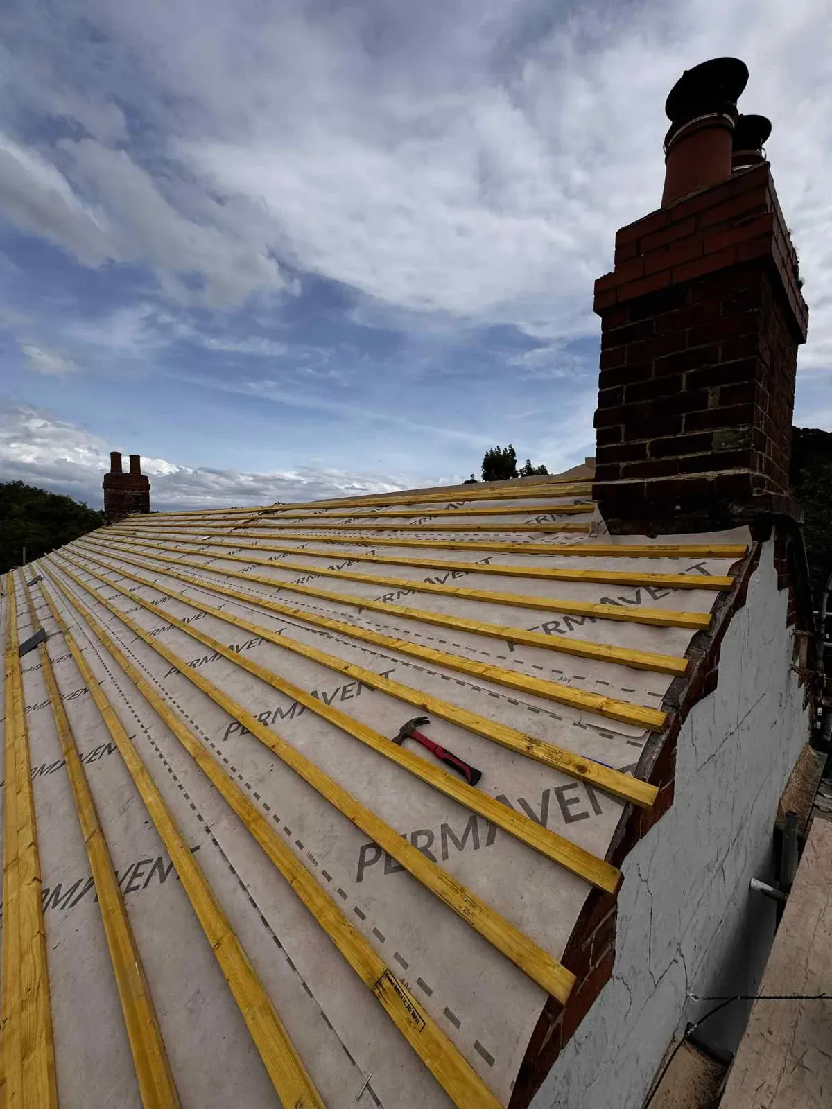 Treated timber battens and breathable membrane fitted during a pitched roof installation in Worcester