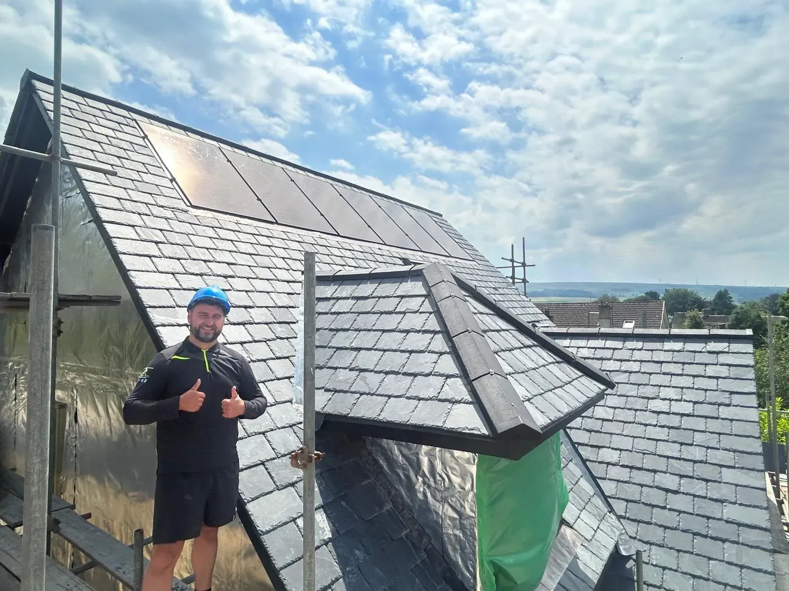 Specialist pitched slate roof and dormer installation completed on a residential property by STORMPROOF ROOFING & REPAIRS LTD