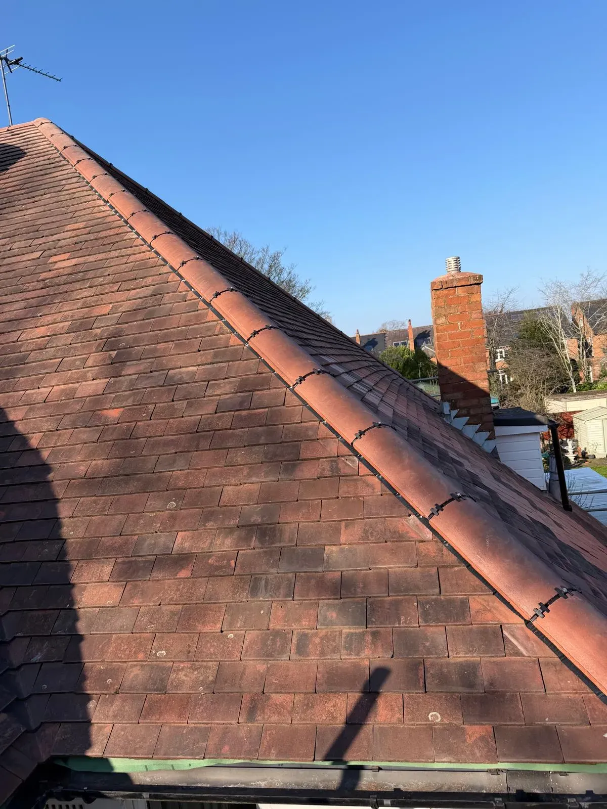 Mechanically fixed dry ridge and hip system installed on a pitched clay tile roof in Worcester
