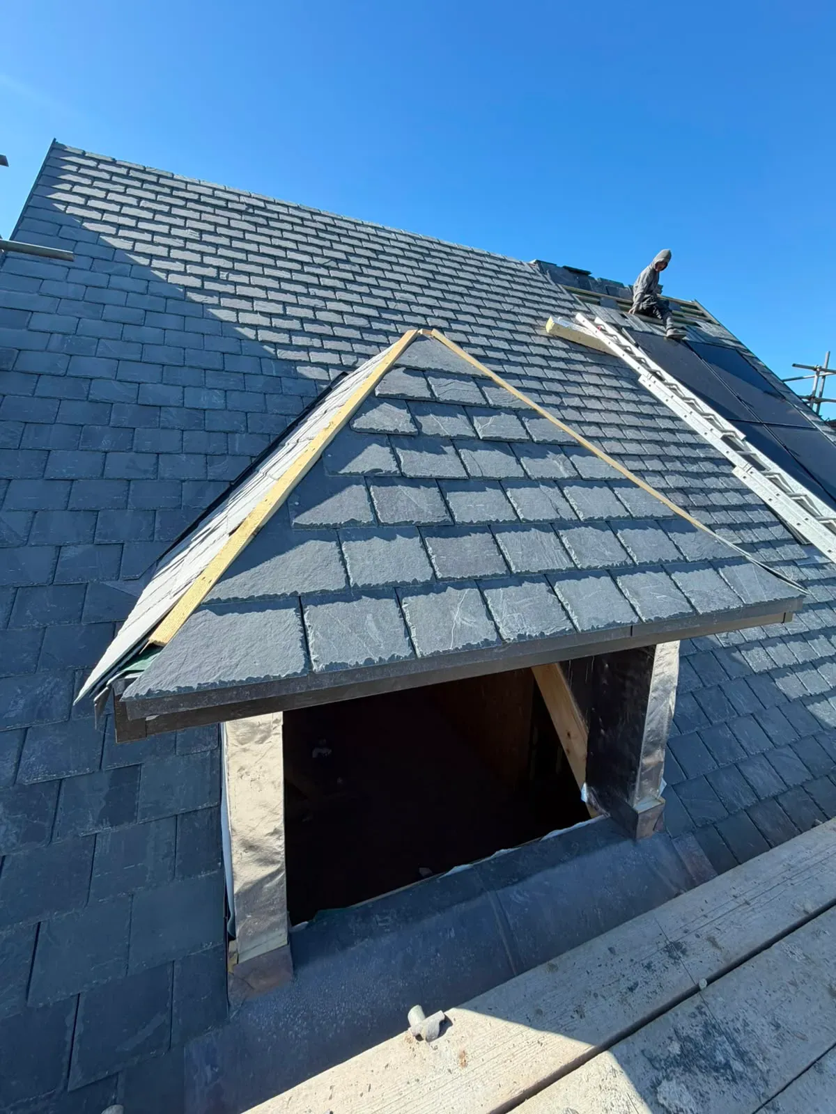 Specialist natural slate pitched roof installation and dormer roofing in progress