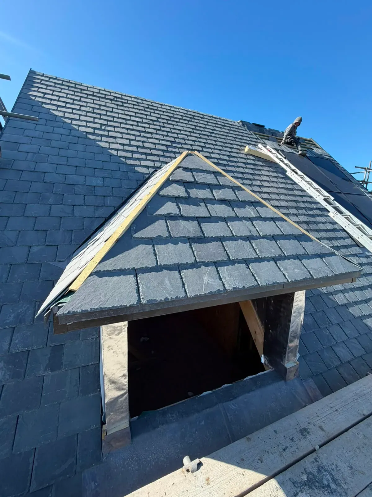 Natural slate pitched roof and dormer window installation with lead flashing work