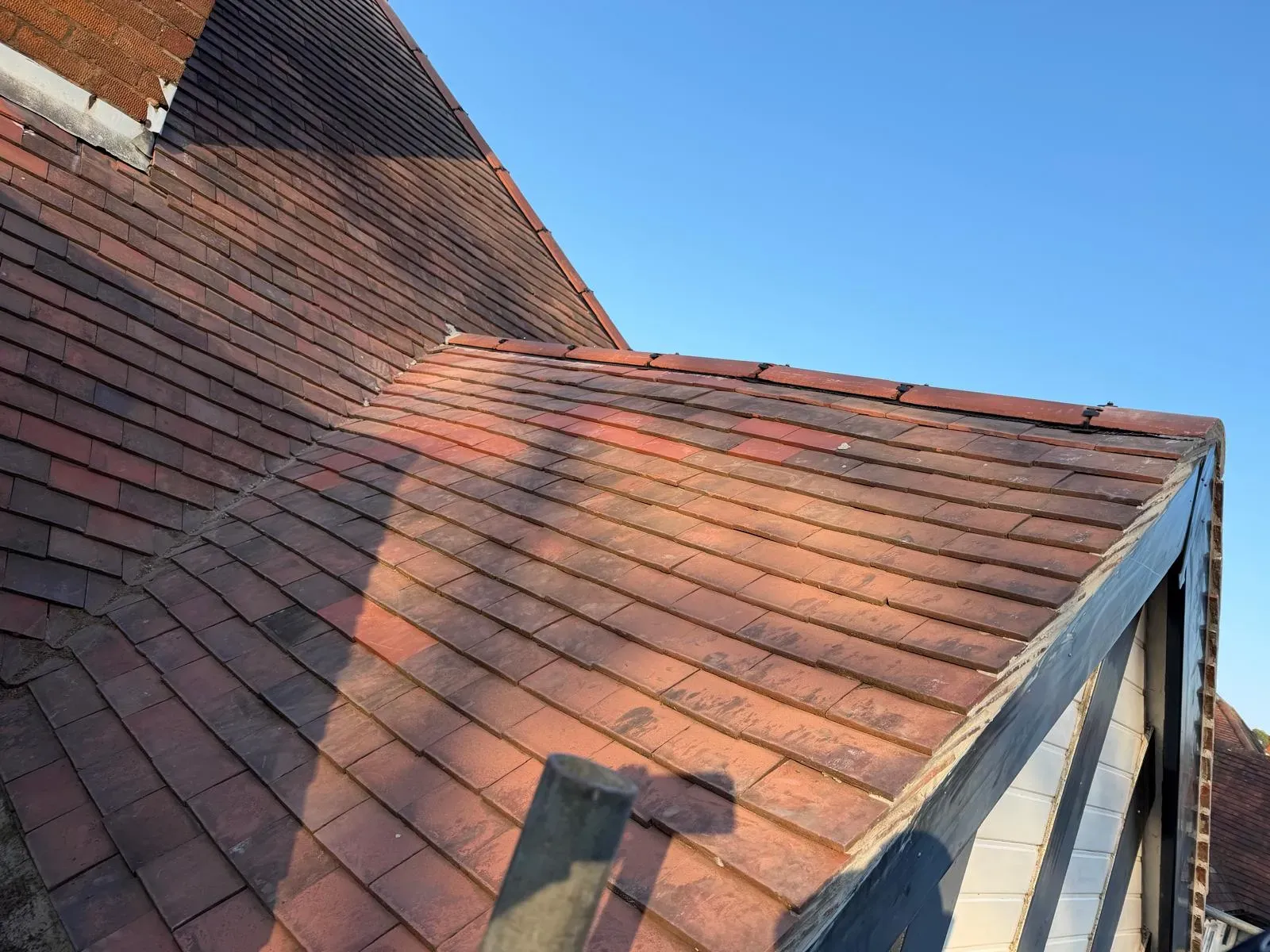 Pitched roof covered with plain clay tiles and secure ridge system on a Worcestershire home