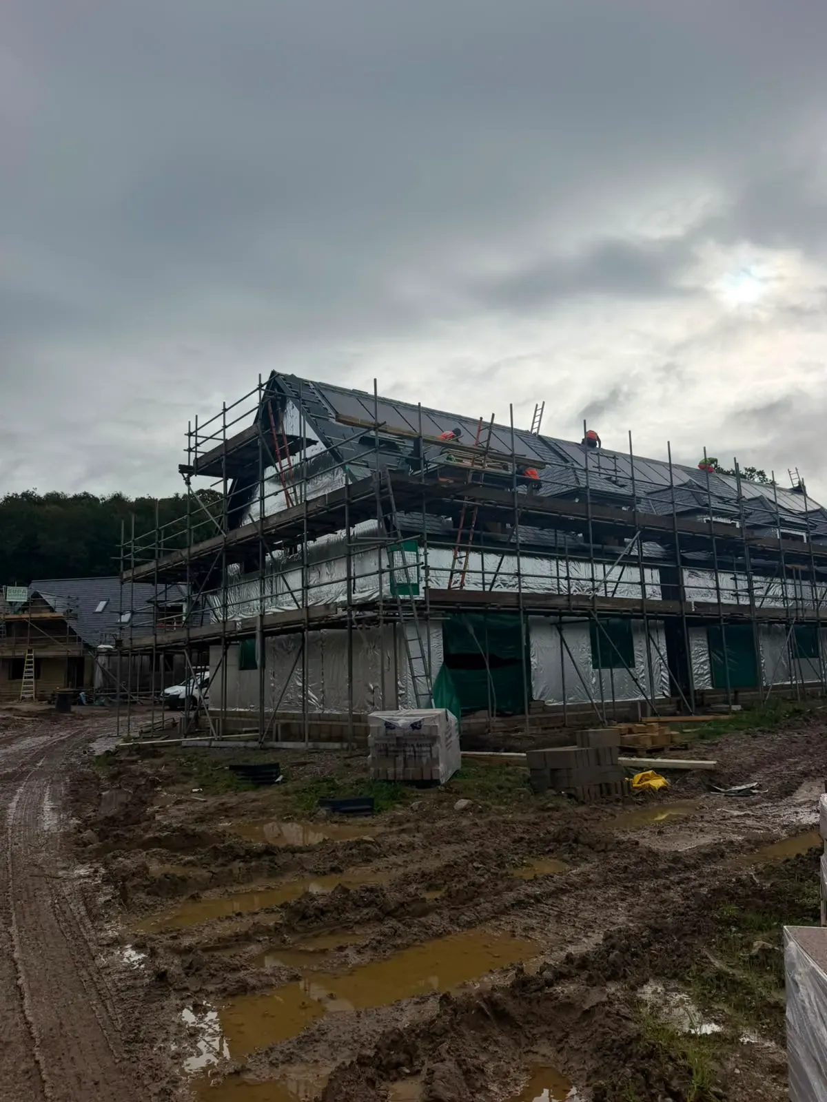 New pitched roof installation on a scaffolded house build by STORMPROOF ROOFING & REPAIRS LTD