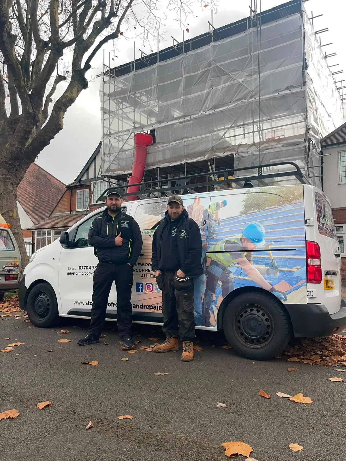 STORMPROOF ROOFING & REPAIRS LTD team standing by their liveried van in front of a scaffolded house in Worcester