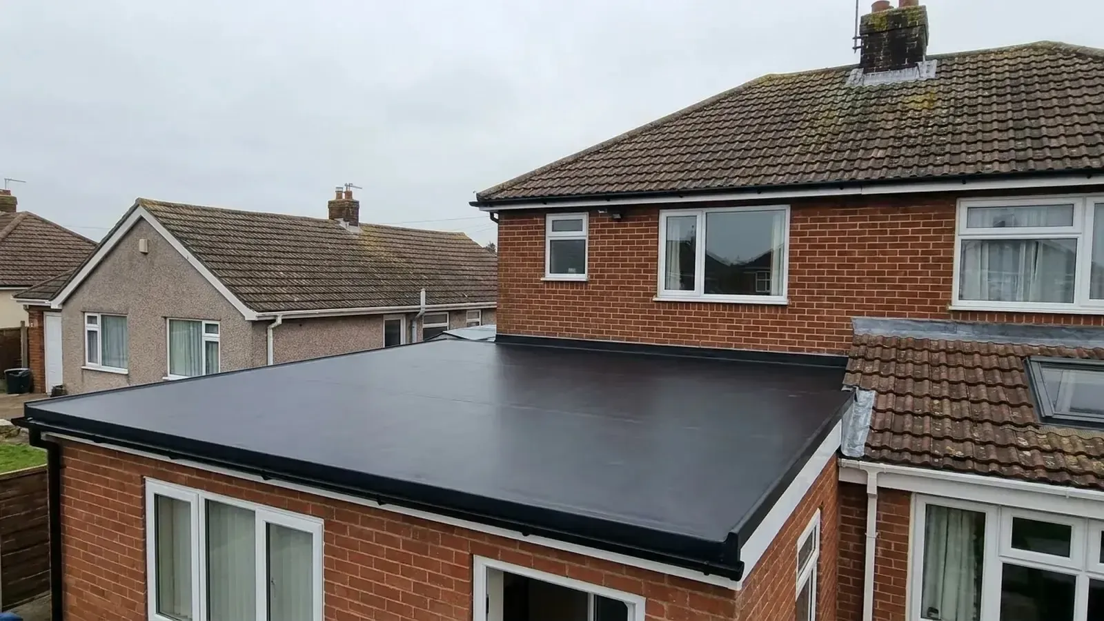 Newly installed EPDM rubber flat roof system on a residential property extension