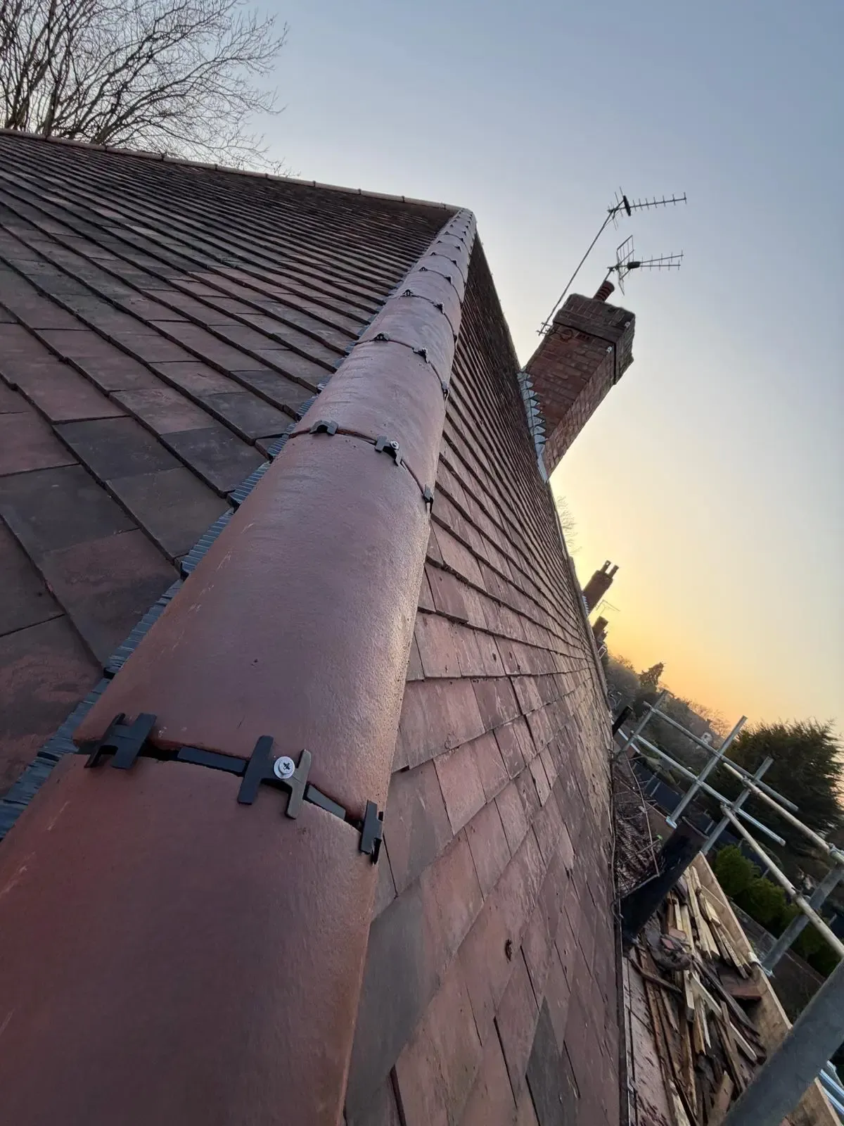 Dry ridge system installation on a clay tile roof in Worcester
