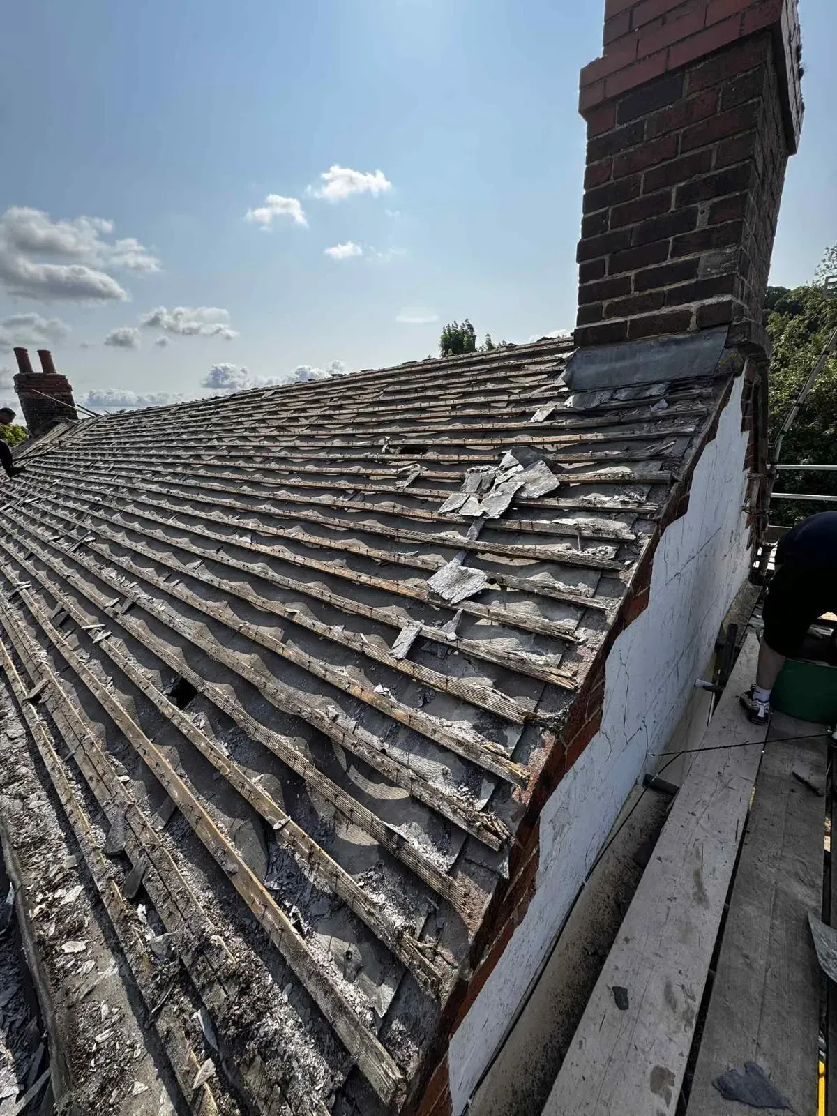 Pitched roof stripped down to timber battens during a new roof installation in Worcester