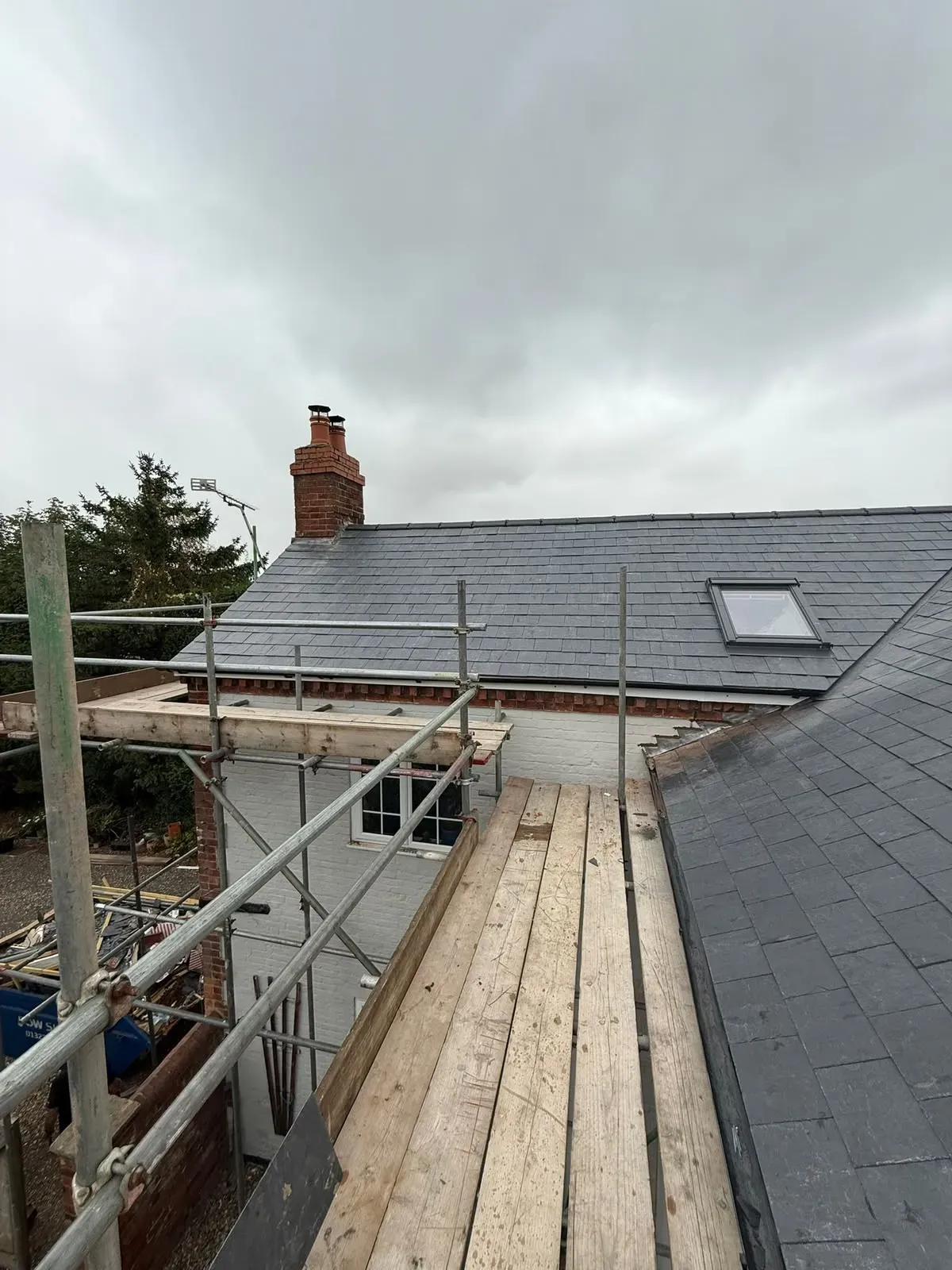 New slate roof installation and pitched roof repairs with scaffolding in Worcester